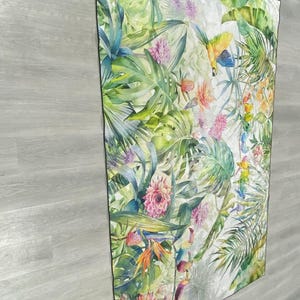 May include: A white background with a tropical print featuring green leaves, pink flowers, and yellow and blue birds.