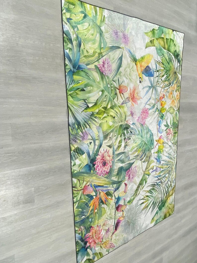 May include: A white background with a tropical print featuring green leaves, pink flowers, and yellow and blue birds.