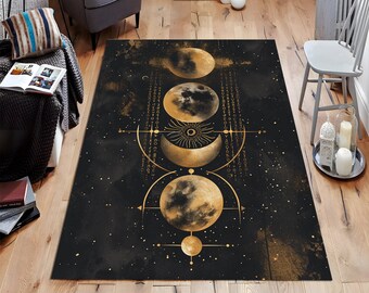 May include: Black and gold area rug with a celestial design featuring moons and stars. The rug has a distressed, vintage look.