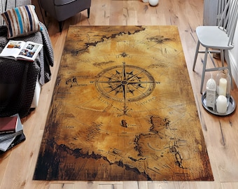 May include: A vintage-style rug with a compass design in the center. The rug is brown and beige with a distressed look. The compass has a black needle and a white background with the letters N, S, E, and W.