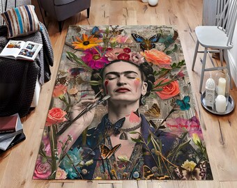May include: A rectangular area rug featuring a portrait of Frida Kahlo surrounded by colorful flowers and butterflies. The rug has a vintage newspaper background with the words "Spring Strange History" visible. The color palette includes pink, orange, blue, and green.