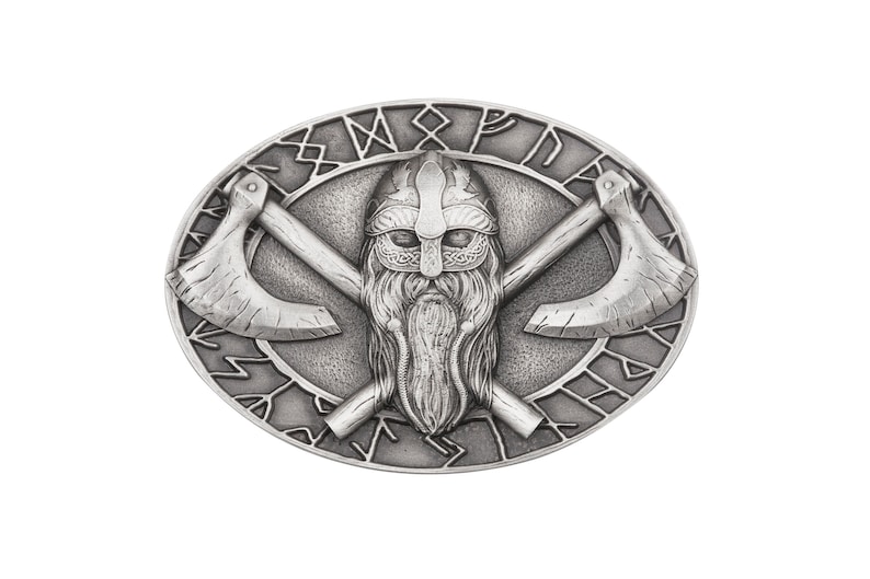 May include: Silver-toned belt buckle with a Viking warrior's face and crossed axes. The buckle is surrounded by a circle of runes.