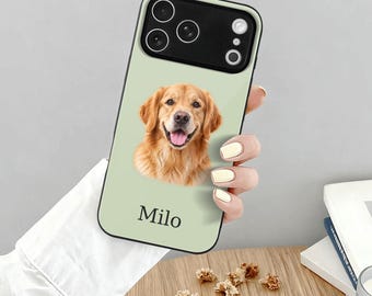 May include: A light sage green smartphone case featuring a portrait of a golden retriever dog and the name Milo printed in black text below the image. The case has a black camera cutout area at the top with three circular lens openings.