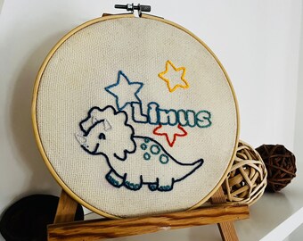 Personalizable embroidery picture with embroidery frame name and desired motif