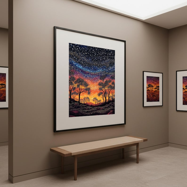 May include: A large framed wall art print featuring a vibrant landscape painting of silhouetted trees against a sunset sky transitioning from orange and red to a deep blue starry night. The artwork is displayed in a black frame with a white mat.