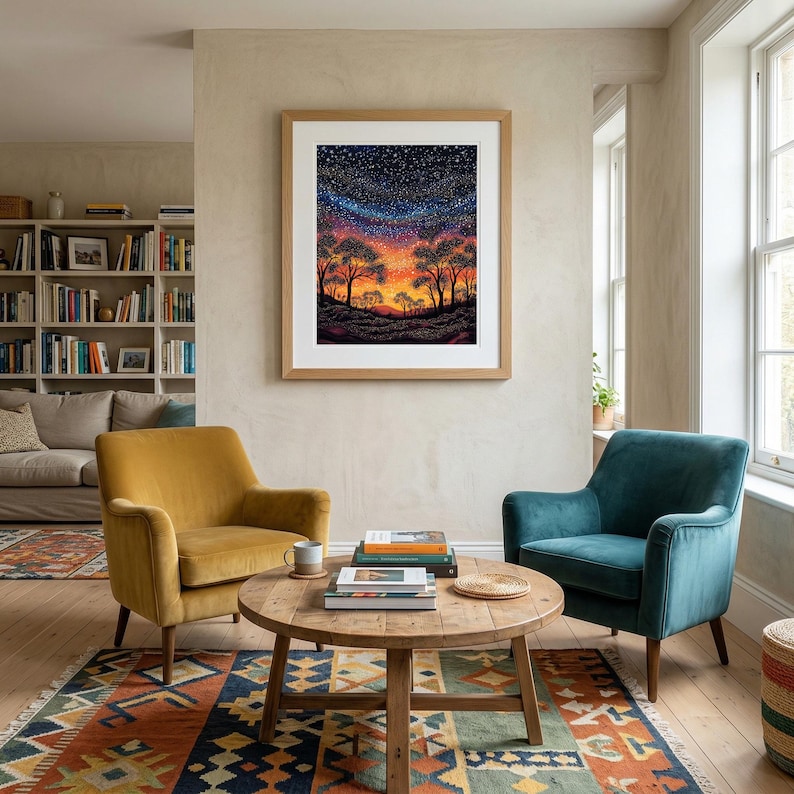 May include: A framed rectangular wall art print featuring a vibrant landscape painting of silhouetted trees against a starry night sky with a glowing orange and purple horizon, displayed in a light wood frame on a neutral-colored wall.