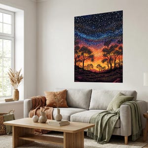 May include: A large rectangular wall art print featuring a vibrant night sky filled with countless white stars above a silhouetted landscape of trees. The horizon glows with warm orange and yellow hues, transitioning into deep purple and blue tones.