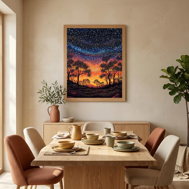 May include: A framed wall art print featuring a vibrant night sky filled with stars above a silhouetted landscape of trees and rolling hills. The artwork displays a gradient of deep blue, purple, and orange hues, capturing a sunset transition.