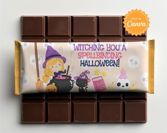May include: A chocolate bar wrapper featuring a cartoon witch with blonde hair, a black cat, a cauldron, a pumpkin, a spellbook, and a skull candle. The text reads "WITCHING YOU A SPELLBINDING HALLOWEEN!" against a light background with skull patterns.