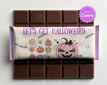 May include: A chocolate bar wrapper featuring the text LET'S GET HALLOWEIRD in purple. The design includes a large pink pumpkin with a black bow, smaller orange and purple pumpkins, flowers, bats, spiders, and ghosts on a light background.