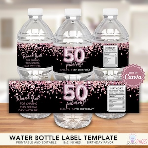 May include: Water bottles with labels for a 50th birthday. The labels are black with pink confetti and the text "50 fabulous!" and "Thank You!" The labels also include nutrition facts.