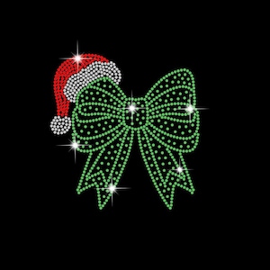 May include: A green and white rhinestone bow with a red and white Santa hat. The bow and hat are made of rhinestones and are perfect for adding a festive touch to any project.