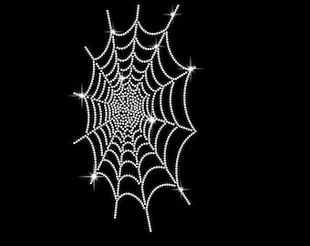 May include: A white spider web made of rhinestones on a black background.