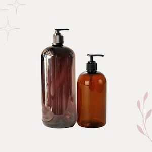 May include: Two amber glass bottles with black pump tops. The larger bottle is taller and wider than the smaller bottle.
