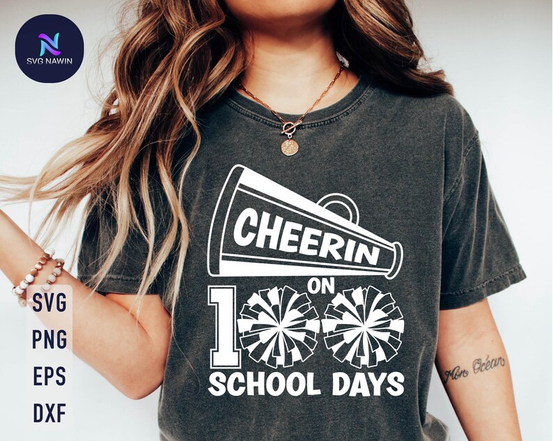 May include: A black t-shirt with a white graphic design of a megaphone with the text "Cheer On 100 School Days". The graphic also includes two white pom-poms.