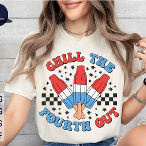 May include: A white t-shirt with a red, white, and blue graphic that says "Chill the Fourth Out". The graphic features three popsicles with red, white, and blue stripes.