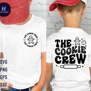 May include: White t-shirt with black text that reads "The Cookie Crew" and a gingerbread man graphic.