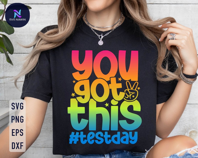 May include: Black t-shirt with a rainbow colored graphic that says "You got this #testday".