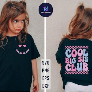 May include: Two black t-shirts with a pink and blue graphic design. The text on the shirts reads "Cool Big Sis Club".