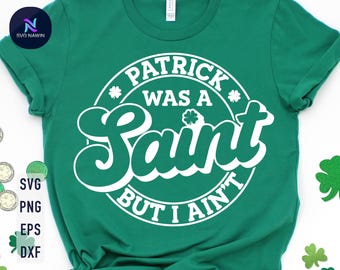 May include: Green t-shirt with white text that reads "Patrick was a Saint but I ain't".