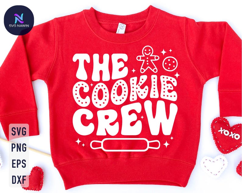 May include: Red sweatshirt with white text that says "The Cookie Crew" with a gingerbread man and a cookie graphic.
