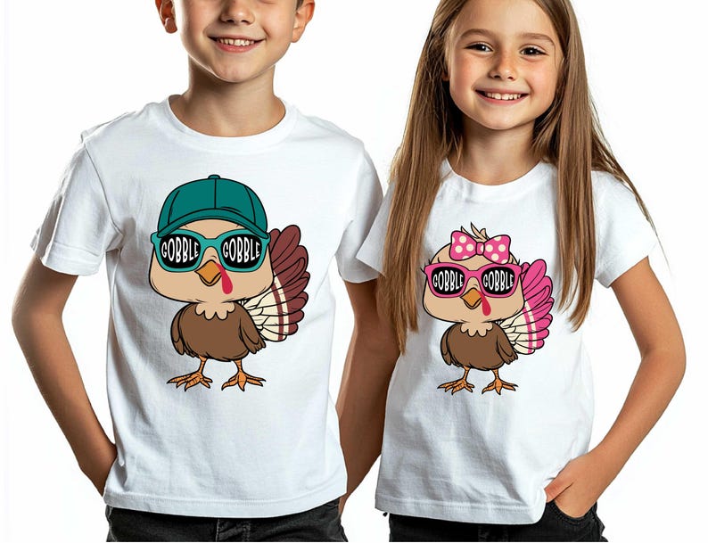 May include: Two white t-shirts with a cartoon turkey wearing sunglasses. The turkey on the left is wearing a blue baseball cap and the turkey on the right is wearing a pink bow. The text "Gobble Gobble" is on the sunglasses of both turkeys.