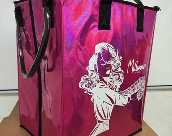 May include: A pink iridescent tote bag with black handles and a zipper closure. The bag features a white graphic of a woman with a crown and the text "Millionaire Mindset".