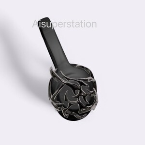 May include: Black headphones with a decorative, intricate design on the earcups. The design is reminiscent of a stylized floral pattern.