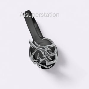 May include: Black headphones with a silver, intricate, decorative design. The headphones have a black headband and a silver, decorative design on the earcups.