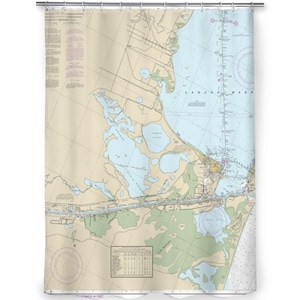 May include: A shower curtain featuring a detailed nautical chart of the Laguna Madre area. The map displays land masses in tan, water bodies in light blue, and various navigational markers, depth soundings, and text labels in black and red ink.