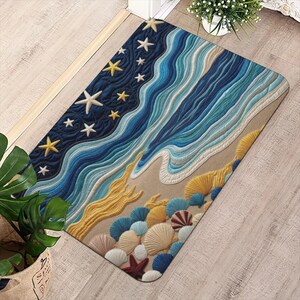 May include: A rectangular doormat with a beach-themed design. The mat features a dark blue sky with yellow and white starfish, and blue and white waves. Seashells in various colors are at the bottom, creating a coastal aesthetic.