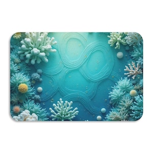 May include: A rectangular decorative item featuring an underwater scene. The design includes various coral formations in shades of white, teal, and yellow, set against a textured, swirling blue background. Small bubbles add detail to the aquatic theme.