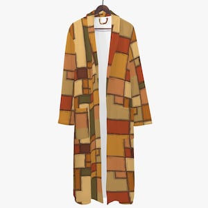 May include: A long-sleeved robe featuring a geometric pattern of rectangular blocks in shades of mustard yellow, burnt orange, brown, and olive green. The garment has a shawl collar, an open front, and two front patch pockets with a white interior lining.
