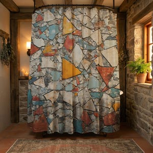 May include: A shower curtain with a stone-like pattern. The design features irregular shapes in shades of gray, blue, yellow, and red. The curtain hangs in a rustic bathroom setting with exposed wooden beams and a stone wall.