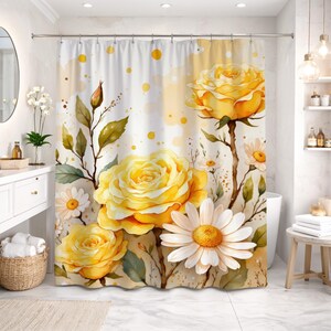 May include: A shower curtain featuring a watercolor-style floral pattern with large yellow roses, white daisies, and green leaves on a white background with scattered yellow dots and splatters. The design includes rosebuds and thin brown stems.