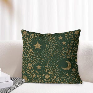 May include: A square throw pillow featuring a dark green background with a repeating gold pattern of crescent moons, five-pointed stars, swirling vines, and various floral elements including roses and irises across the entire surface.