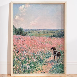 May include: A framed print depicting a dog in a field of pink flowers. The artwork shows a light blue sky with clouds and a green field in the background. The dog is brown and white. The frame is a light wood colour.