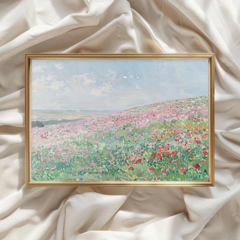 May include: A framed painting of a field of pink and red wildflowers with a blue sky and white clouds in the background.