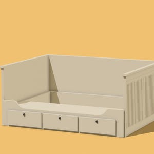 May include: A beige wooden dog bed with three drawers. The bed has a raised edge and a slatted back.