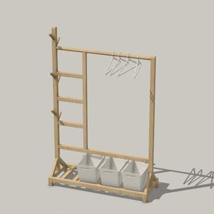 May include: A wooden clothes rack with a ladder on one side and three white storage bins on the bottom shelf. The rack has a metal bar for hanging clothes and several hooks on the side.