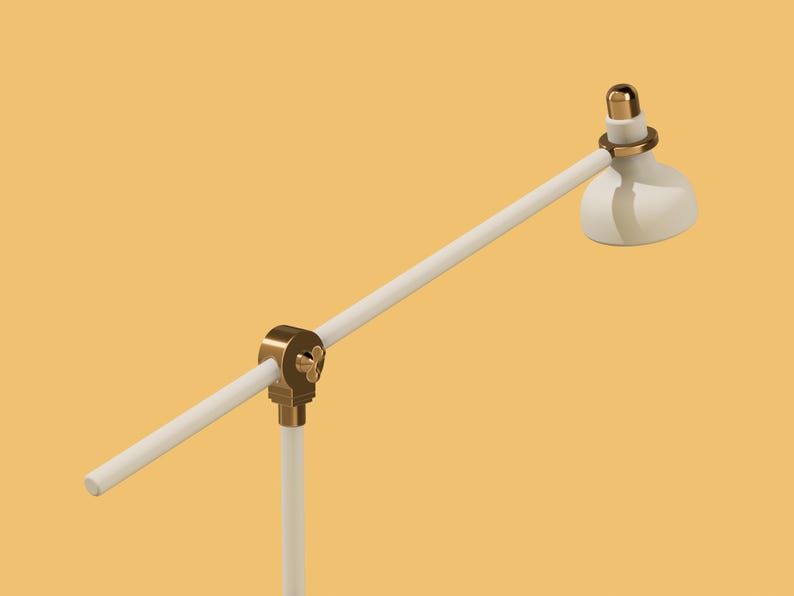May include: A white desk lamp with a gold-colored base and adjustable arm. The lamp has a white shade.