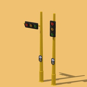 May include: Two yellow traffic light poles with red, yellow, and green traffic lights. One pole has a blue arrow pointing left and the other has a blue arrow pointing right.