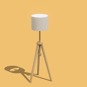 May include: A white lampshade with a wooden tripod stand. The lamp is on a yellow background.