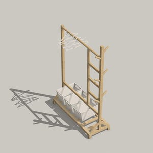 May include: A wooden clothes rack with a ladder and three storage baskets. The rack has a white metal bar for hanging clothes.