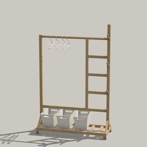 May include: A wooden clothes rack with a ladder on the side and three white storage bins on the bottom shelf. The rack has a metal bar for hanging clothes and white plastic hangers.