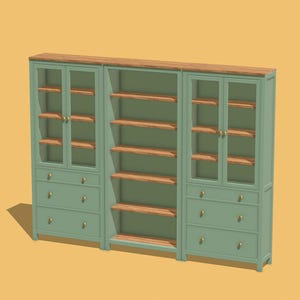 May include: A three-section bookcase with glass doors and drawers. The bookcase is painted a light green colour with wood-toned shelves. The bookcase has brass hardware.