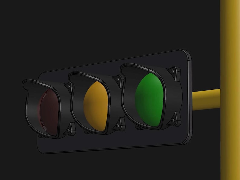 May include: A traffic light with three lights: red, yellow, and green. The green light is on.