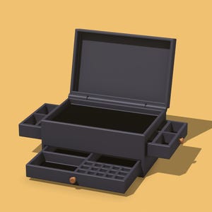 Könnte beinhalten: Eine dunkelgraue Schmuckschatulle mit offenem Deckel, Seitenfächern und ausziehbaren Schubladen. Die Schatulle hat eine rechteckige Form mit glatter Oberfläche und kleinen, runden Knöpfen aus Holz an den Schubladen. Der Hintergrund ist hellorange.