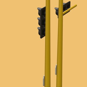 May include: A yellow traffic light with three black lights, one red, one yellow, and one green. The traffic light is mounted on a yellow pole.