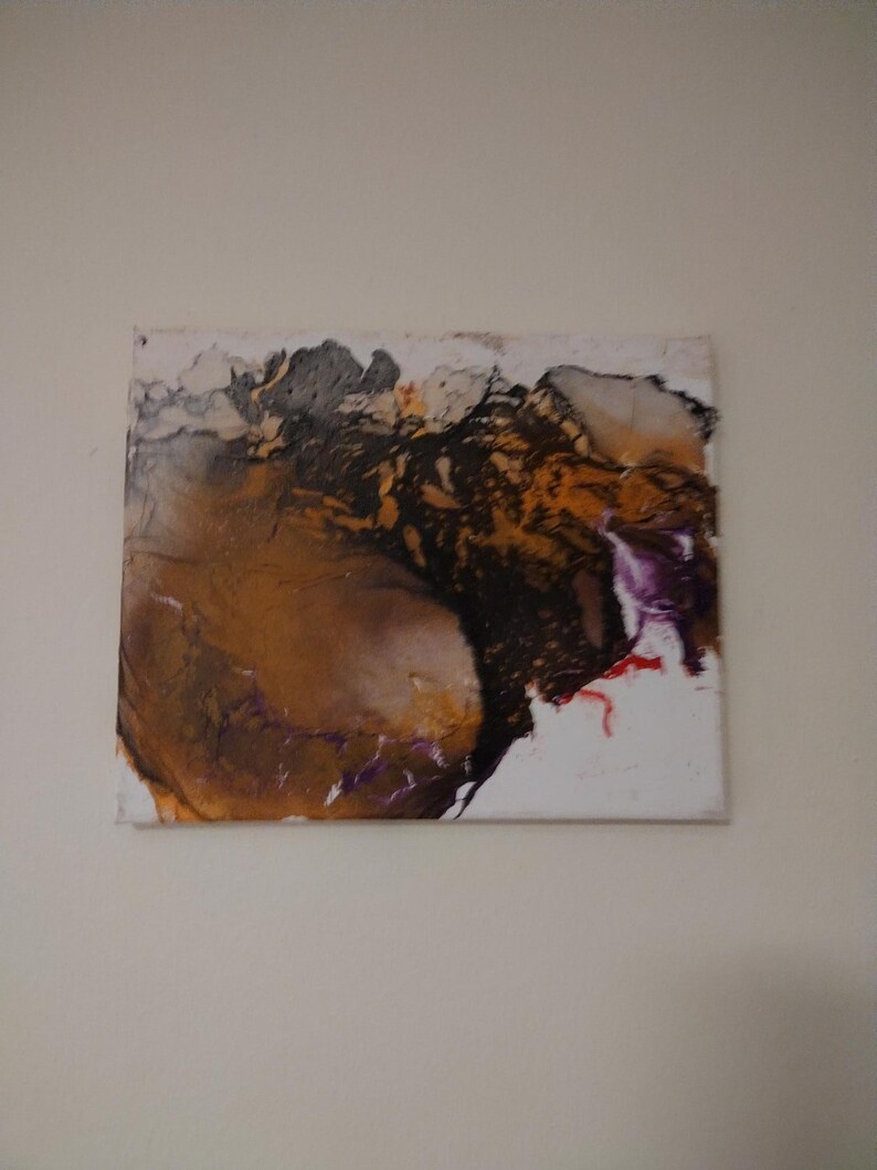 May include: Abstract painting on canvas with brown, black, purple, and red paint. The painting has a fluid, organic style.